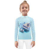 Child wearing Kirigami Garden rash guard playing outdoors