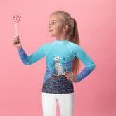 Colorful Kirigami pattern on kids rash guard