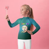 Forest Friends Kids Rash Guard on a child at the beach