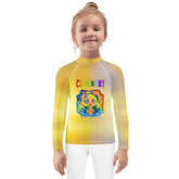 Child wearing Hansel and Gretel kids rash guard at the beach.
