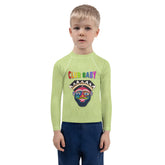 Child wearing Aladdin-themed rash guard on beach