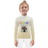 Kid wearing Sleeping Beauty Dream rash guard at the beach