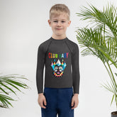 Child wearing enchanted forest themed rash guard.