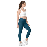 Woman in Forest Canopy leggings, featuring leaf texture and pockets, immersed in nature's beauty.