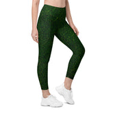 Woman exploring an enchanted garden wearing leaf texture leggings with functional pockets.