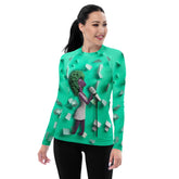 Woman wearing Jazz Fusion rash guard while surfing, showcasing style and durability.