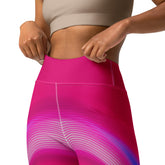 Navigating a yoga sequence in the star-inspired Cosmic Flow Wavy Gradient Leggings.