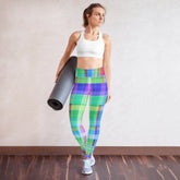 Practicing yoga in Azure Wash Yoga Leggings against a tranquil beach backdrop.