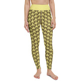 Adopting a yoga pose in Celestial Glow Tristar Yoga Leggings under the evening sky.