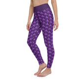 Engaging in a yoga session while wearing Aurora Borealis Tristar Yoga Leggings.