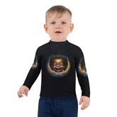 Child wearing CB3-32 rash guard while playing at the beach