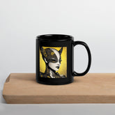 Black glossy mug from Creative Current on wooden table.