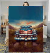 God Bless America Sherpa blanket draped on a couch.