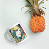 Graphic Greatness II white glossy coffee mug on a wooden table.