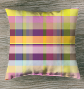 Vibrant Watercolor Strokes Indoor Pillow displayed on a bed, adding artistic flair to the bedroom decor.