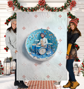 Mountain Serenity Sherpa Blanket laid out on a bed with a mountain view in the background.