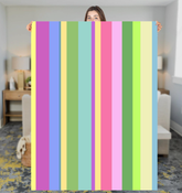 Cozy Cabin Stripe Sherpa Blanket on a comfortable living room sofa.