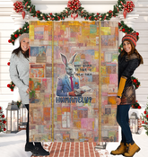 Rocker Rabbit playing guitar on Sherpa blanket.