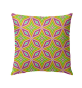 Vibrant Kaleidoscope Dreams pillow on outdoor patio chair.