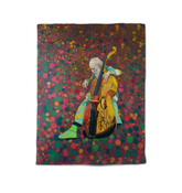 Vibrant Meadow Mosaic Comforter on a bed.