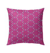 Vibrant Medallion Magic Outdoor Pillow on a garden chair