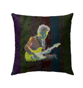 Vibrant Hibiscus Harmony Outdoor Pillow on garden chair.