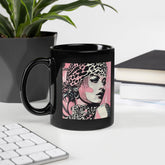 Painted Passions elegant black glossy coffee mug on a table.