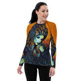 Woman wearing Pen Pals rash guard at the beach.