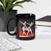 Black glossy mug with playful dance designs for women.