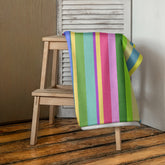 Urban Chic Stripe Bath Towel on a bathroom rack, showcasing its stylish design and plush texture.