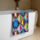 Whispering Vines Art Nouveau Bath Towel on a bathroom towel rack.