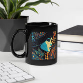 Visual Vibrancy Black Glossy Coffee Mug on wooden table.