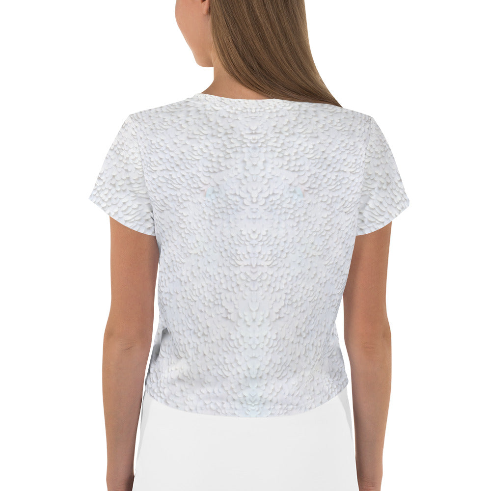 Close-up of geometric papercut pattern on trendy crop top.