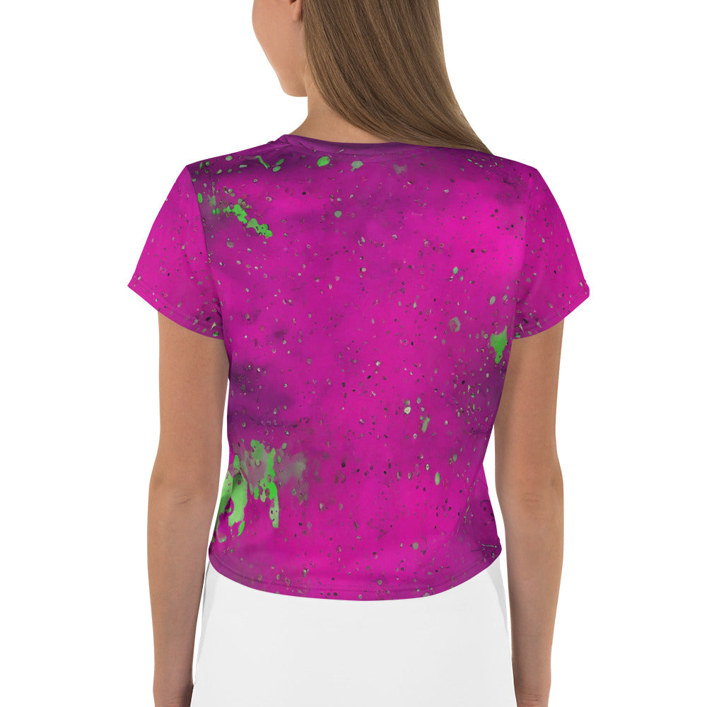 Vibrant paint splashes on trendy women's crop top.