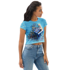 Celestial Crane Origami Women's Crop Tee paired with jeans in a casual setting.