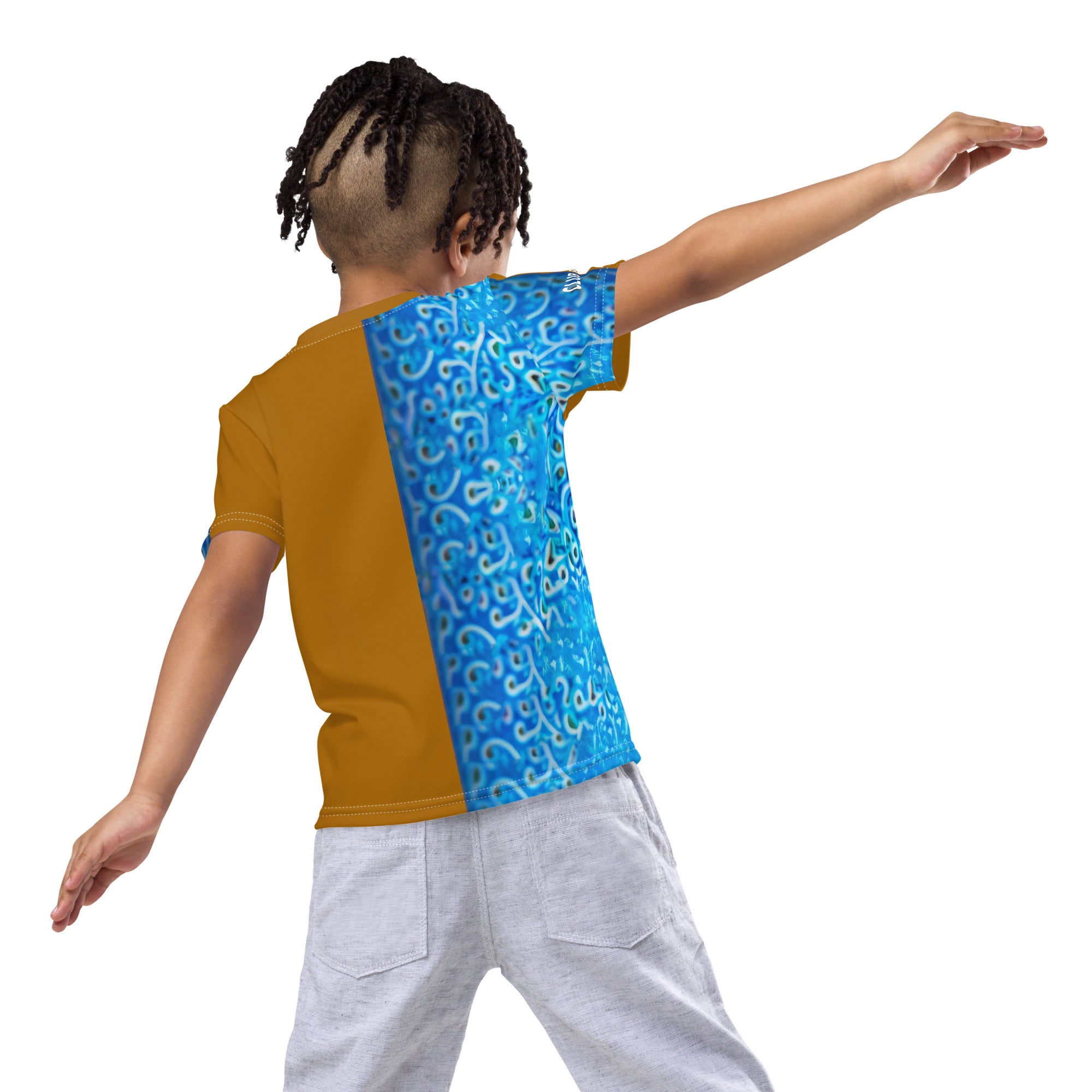 Child playing outdoors in colorful Paper Art Joy t-shirt.