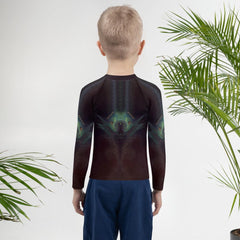 Child wearing CB3-88 Rash Guard enjoying beach playtime.