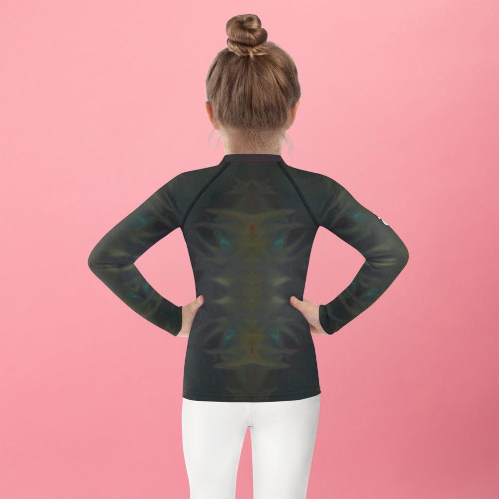 Child wearing CB3-75 rash guard during outdoor sports.