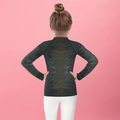 Child wearing CB3-75 rash guard during outdoor sports.