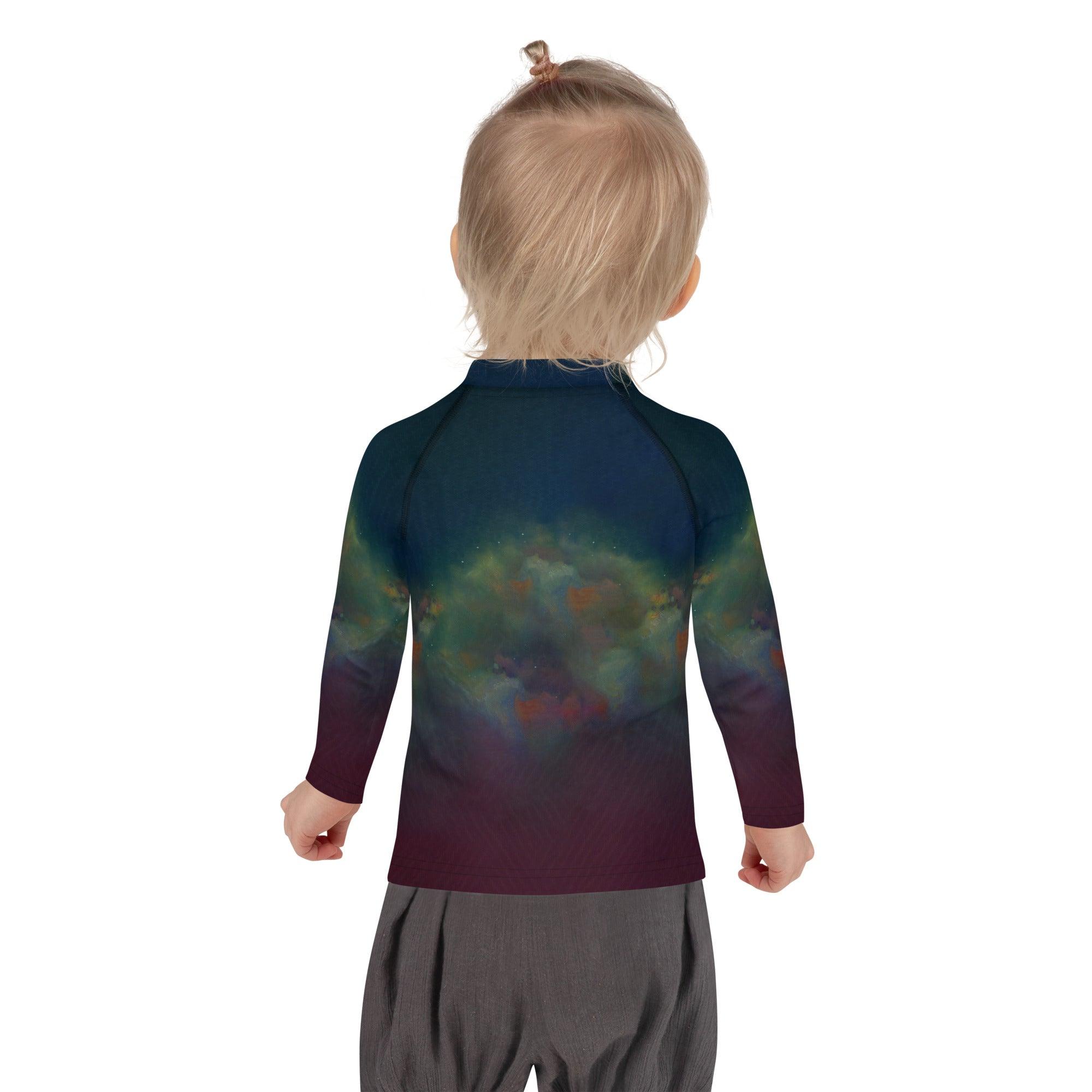 Child wearing CB3-104 Kids Rash Guard enjoying beach time.