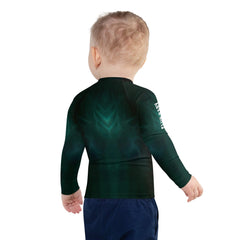 Group of children wearing CB3-97 rash guards on the beach