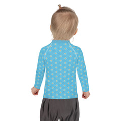 Child wearing kirigami patterned rash guard