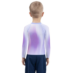 Child wearing Sleeping Beauty Rash Guard at the beach