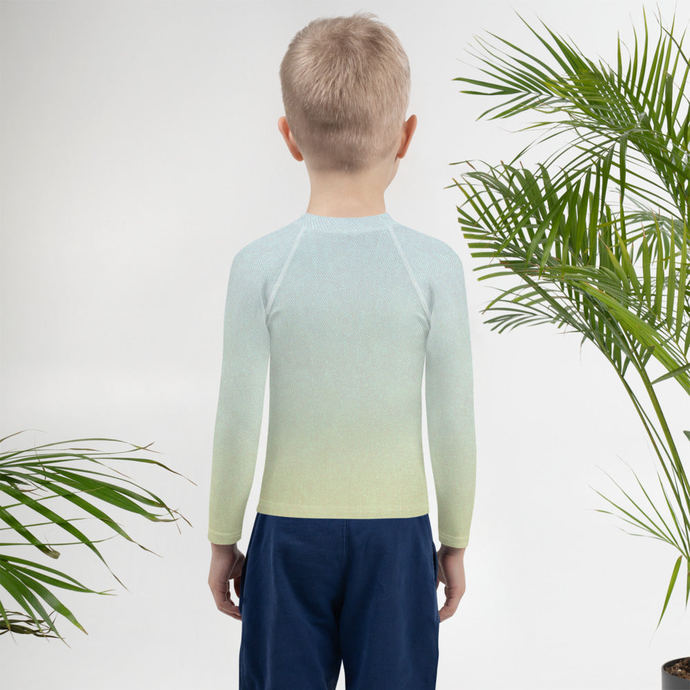 Child wearing Puss in Boots print rash guard