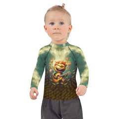 Happy kid in CB3-109 rash guard at the beach