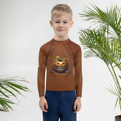 Kid in CB3-130 Rash Guard playing on the beach