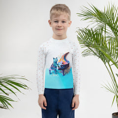 Kid swimming in pool wearing Paper Crane Rash Guard