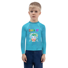 Child wearing Fairy Godmother rash guard at the beach