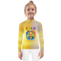 Child wearing Hansel and Gretel kids rash guard at the beach.
