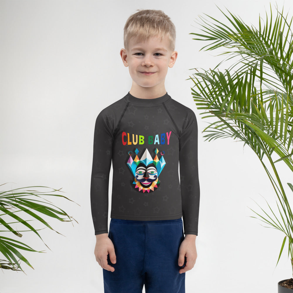 Child wearing enchanted forest themed rash guard.
